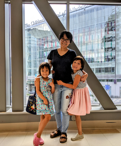 Becky Yu and her two daughters at the Perelman School of Medicine